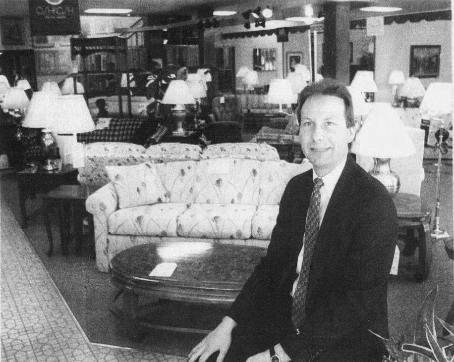 Our classic collection of lamps and furnishings, with one of our salesmen showcasing it.